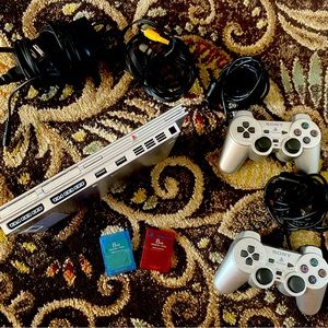 PlayStation 2 with 2 remotes, 2 8BG memory cards